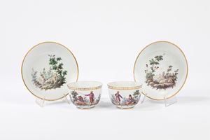 Pair of polychrome porcelain cups with saucer 