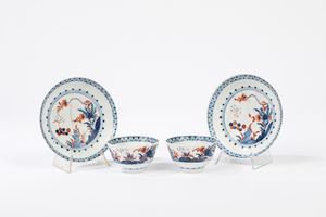 Two polychrome porcelain cups with saucer