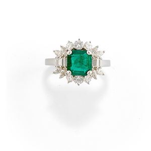 A 18K white gold, emerald and diamond ring