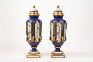 Pair of polychrome porcelain vases with lids, 19th century