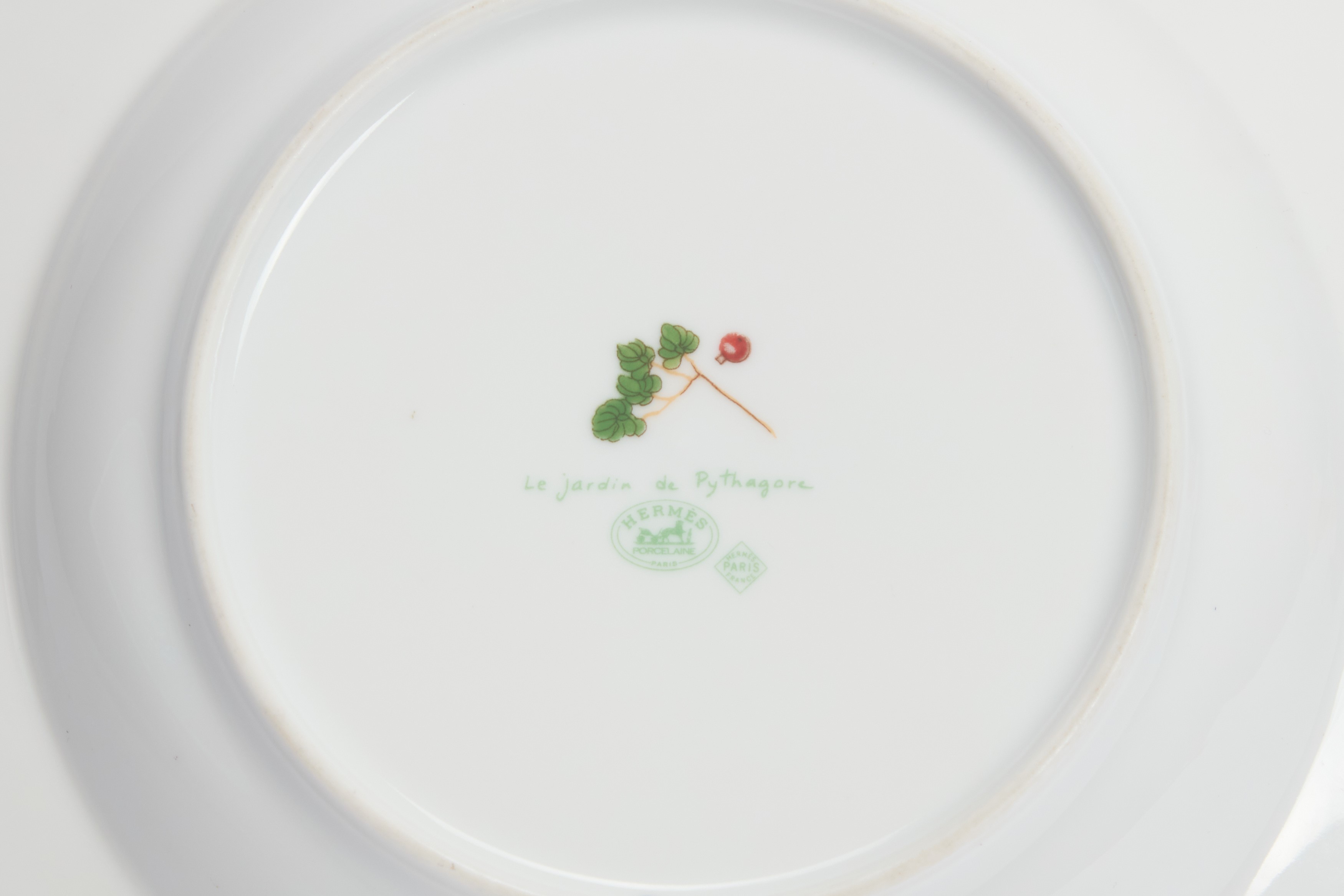 Hermès - Set di sette pezzi in porcellana bianca decorati con motivo 'Le Jardin de Pythagore'
