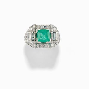 A 18K white gold, emerald and diamond ring