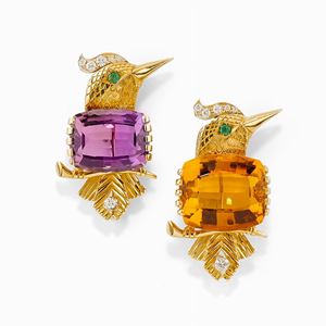 A couple of 18K two-color gold, emerald, diamond, quartz and amethyst brooches, signed Cartier