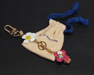 Charm per borsa Vivienne, metallo dorato con sacchetto