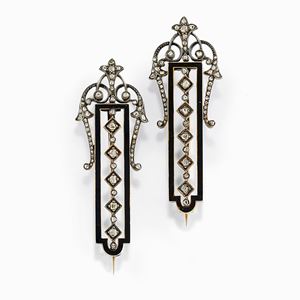 A couple of silver, 18K yellow gold, enamel and diamond brooches