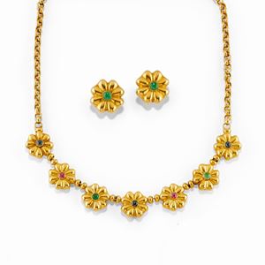 A 18K yellow gold, sapphire, ruby and emerald demi parure