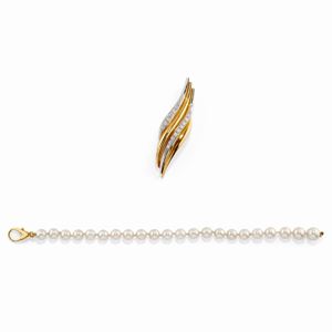 A 18K two-color gold, diamond and cultured pearl brooch