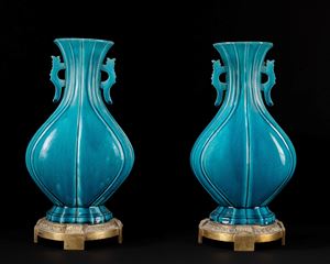 A pair of turquoise glazed vases
