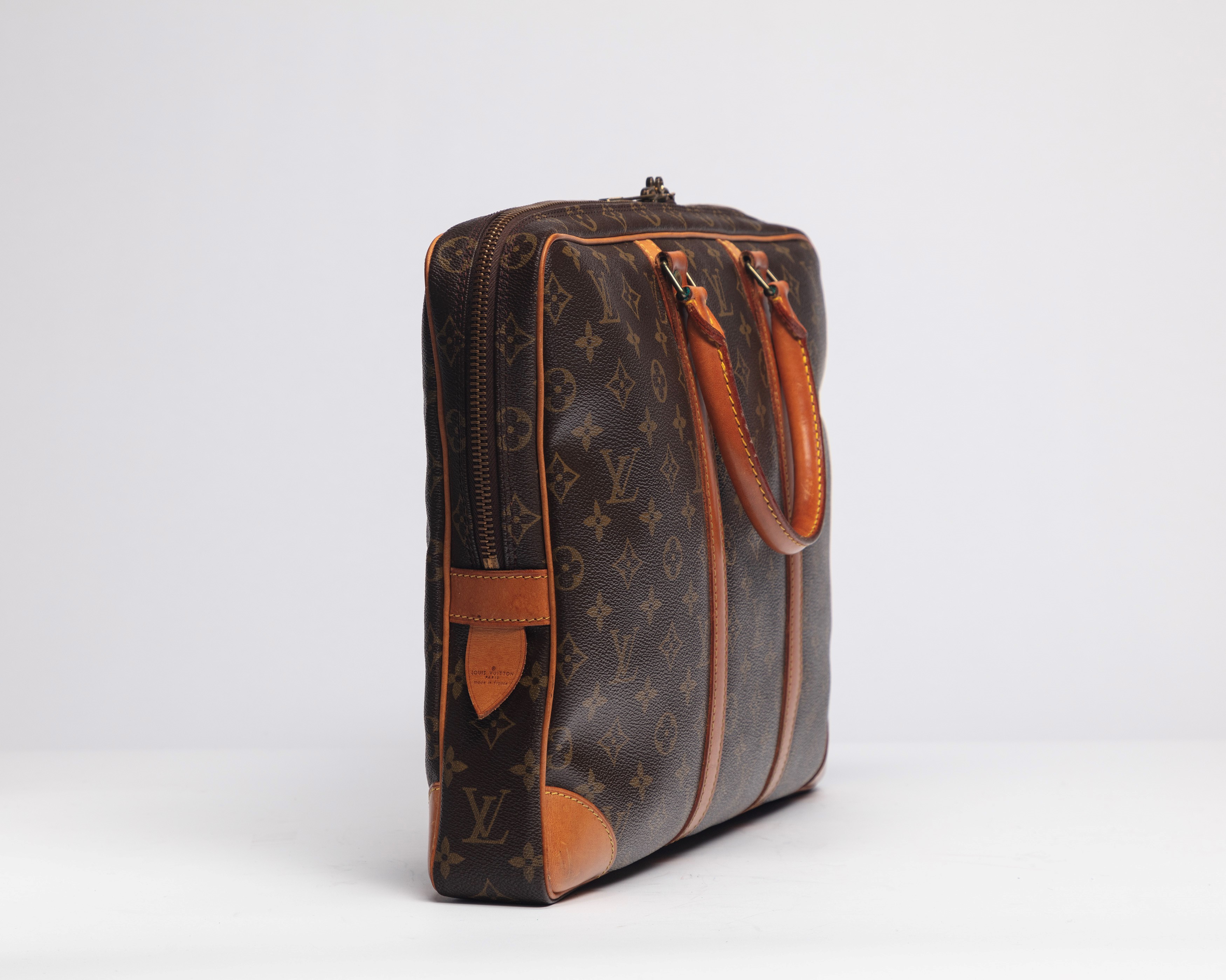 Louis Vuitton - Valigetta in tela monogram con profili in vacchetta e dettagli in metallo, 1986