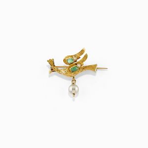 A 18K yellow gold, emerald, uncolored gemstone and ruby brooch