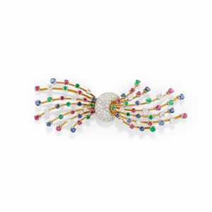 A 18K two-color gold, sapphire, emerald and diamond brooch