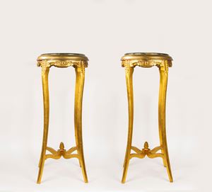 Pair of carved and gilded wooden gueridons with green marble top, 20th century