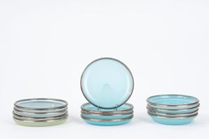 Twelve opaline saucers with silver rim, 20th century