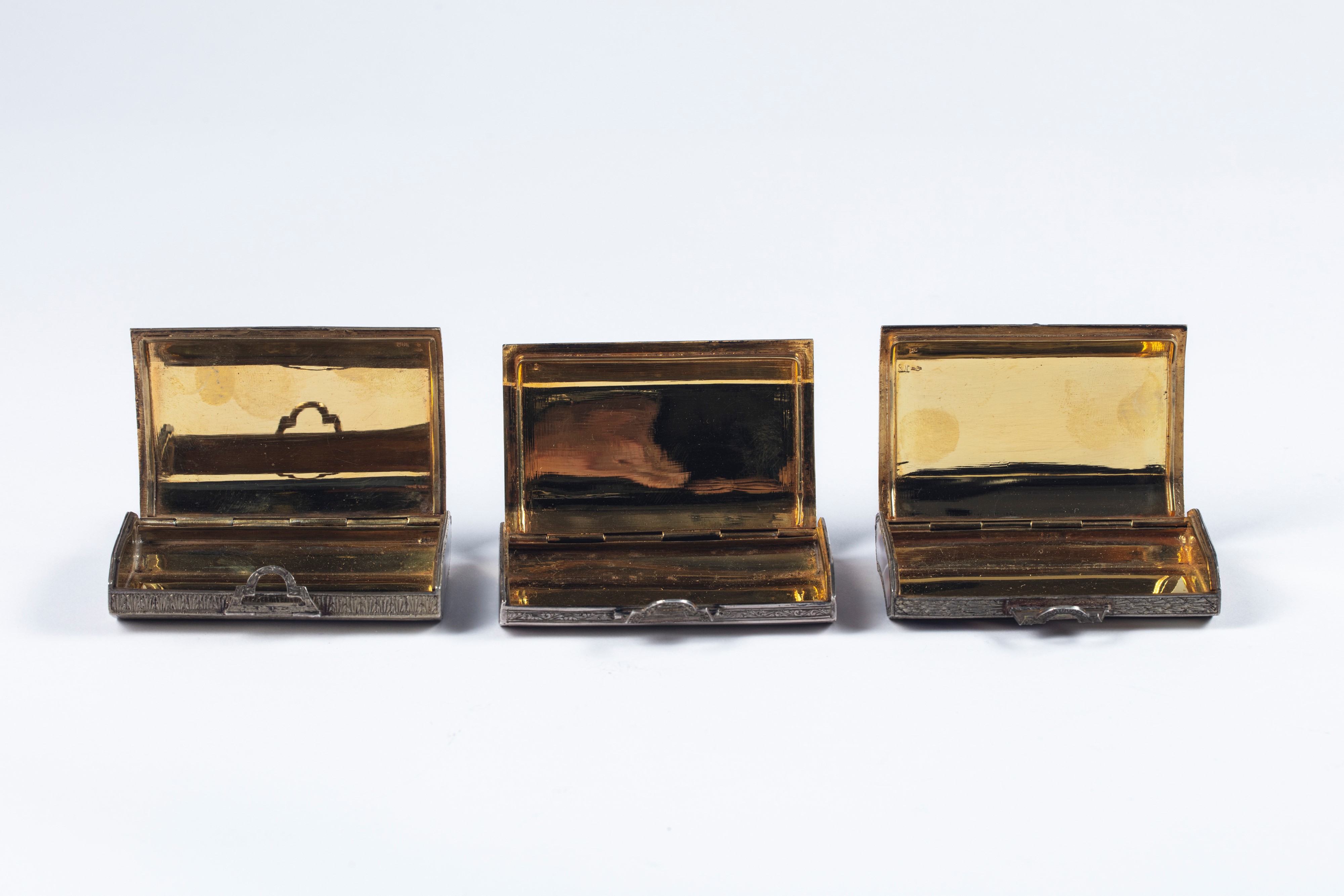 Tre portasigarette in argento e pietre dure