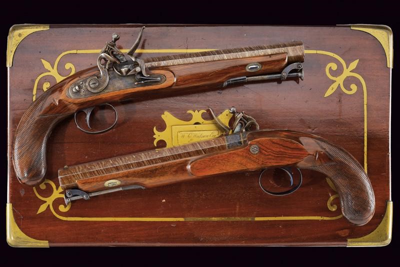 Paio di pistole a pietra focaia di Darwin in cassetta