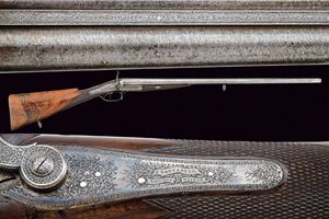 A fine double-barreled center fire shotgun with external cocks by Lancaster