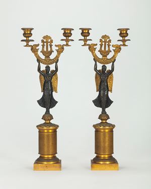 A pair of gilded and patinated bronze candelabra, 19th century