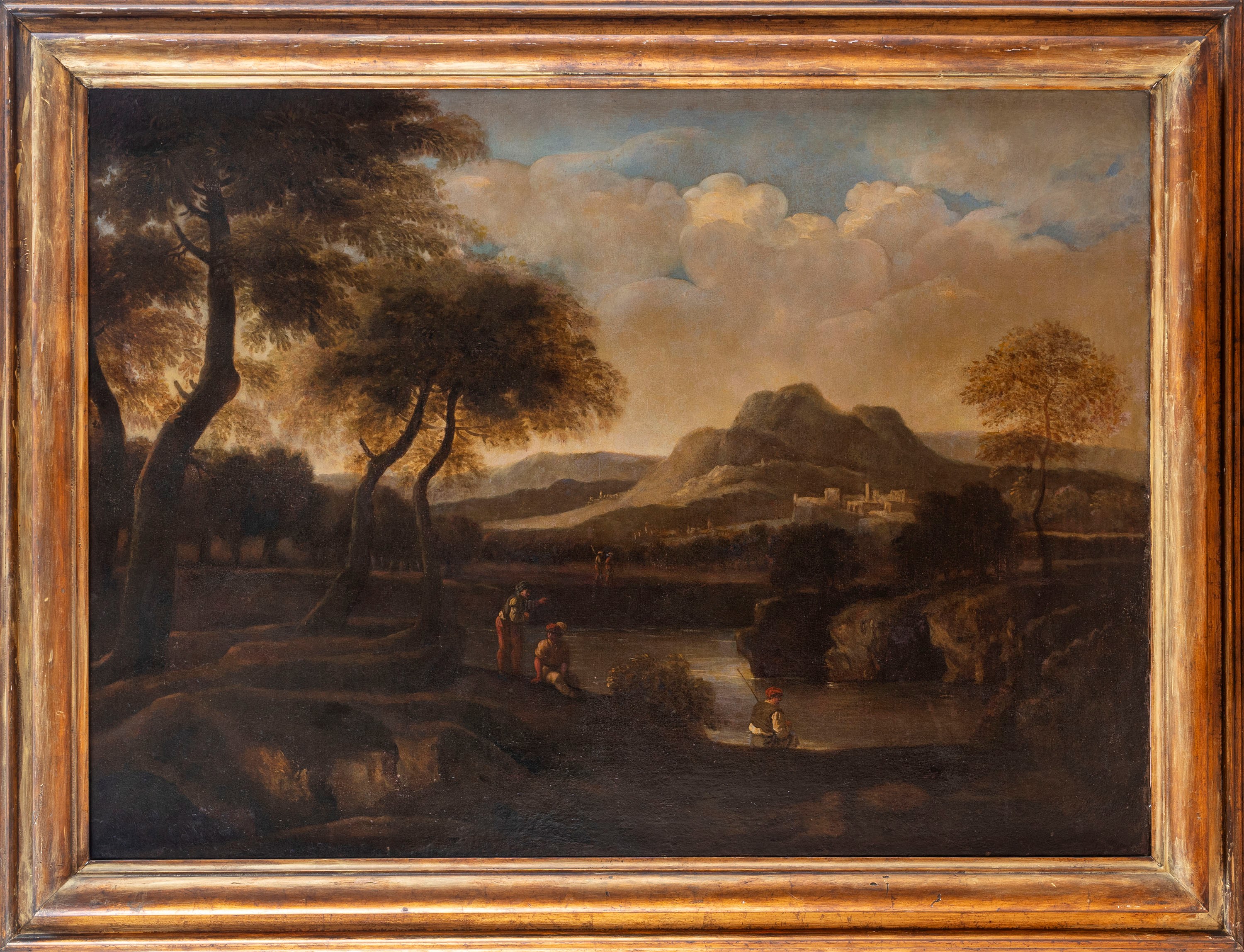 Paesaggio fluviale con pescatore in riva