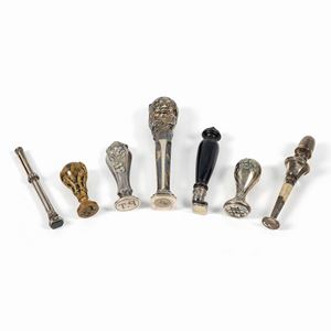 Seven silver, wood and bronze seals