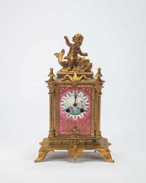 Bronze and polychrome porcelain mantel clock. 19th century.