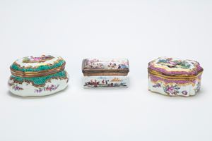 Three porcelain snuff boxes. Manufactures of the 19th century