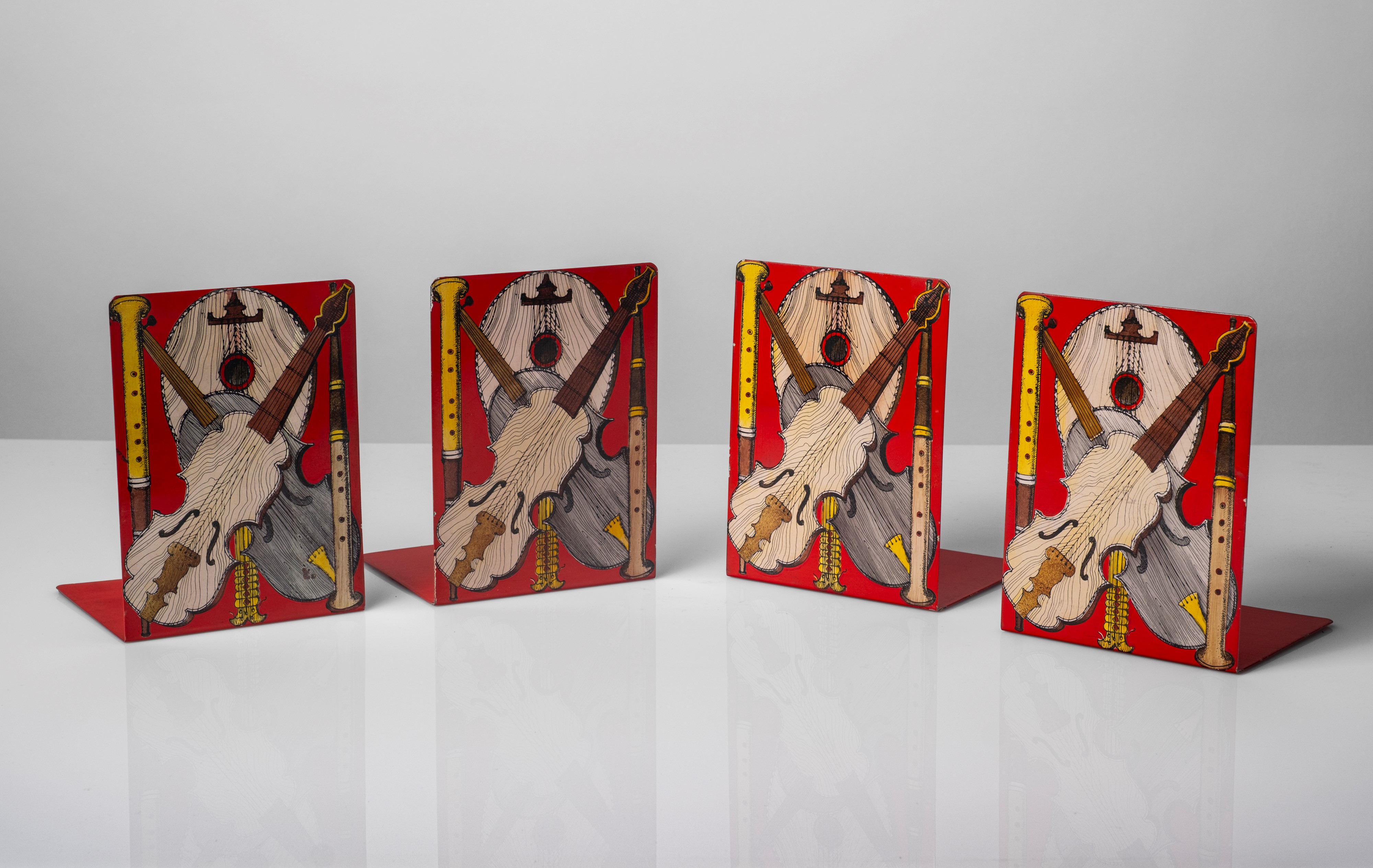 Set di quattro fermalibri, decoro Strumenti musicali