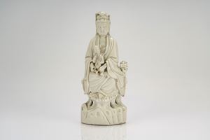 White porcelain figure of Guanyin with child, China, late Qing dynasty