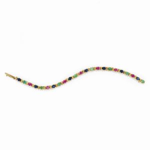 A 18K yellow gold, diamond, ruby, sapphire and emerald bracelet