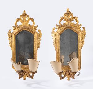 Pair of carved and gilded wooden swing mirrors, 19th century