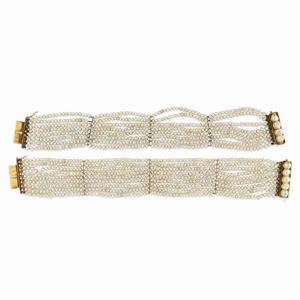 A couple of 18K yellow gold and pearl bracelets