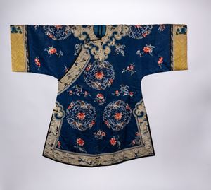 Lot of two blue-ground silk robes, one decorated with floral, ruyi and figural motifs, the other with gilt monochrome motifs, China, late Qing dynasty