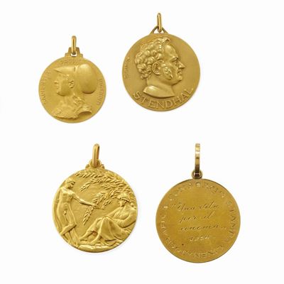 Quattro medaglie commemorative in oro giallo 18K