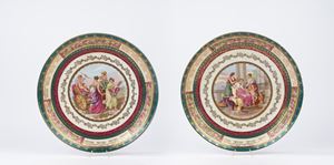 Pair of polychrome and gold porcelain display plates, Jungerhans Rotterdam