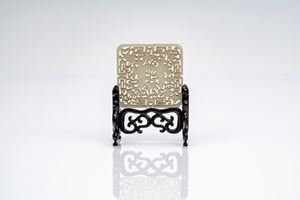 Pierced white jade plaque with figures and stylized clouds, on wooden stand, China, late 19th century