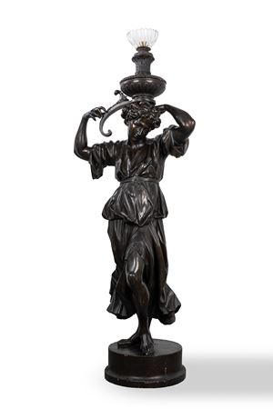 Female figure holding a torch in carved and ebonized wood, 19th century