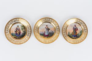 Three polychrome porcelain plates with women in folk costume from the Kingdom of the Two Sicilies, Naples, 19th century