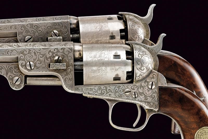 Importante paio di Colt Model 1851 Navy con incisioni di fabbrica stile Gustave Young, in cassett...