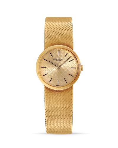 Orologio da polso in oro 18k con quadrante a rilievo, anni '70