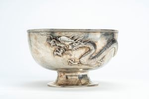 Repoussé silver bowl with a rampant dragon, China, dated 1933