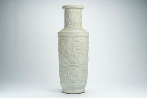 Large white porcelain rouleau vase, decorated in relief with mythical animals, clouds and ruyi motifs,  early 20th centur