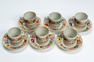Six porcelain cups with saucers, decorated in polychrome floral motifs with gilding. France, early 19th century