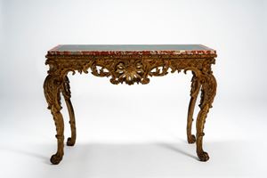 Carved wood console table with cabriole legs adorned with foliate motifs, volutes and paw feet; the pierced frieze centered by a shell motif, 19th century