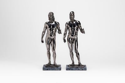 Coppia di sculture rivestite in lamina d'argento 925