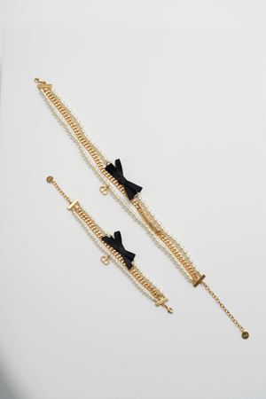 Demi parure composta da un girocollo a chocker e un bracciale 