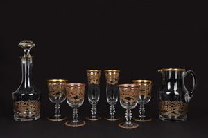 Servizio tete &agrave; tete in cristallo molato decorato in oro, Versace