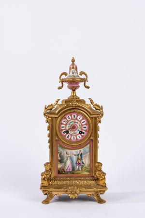 Pendola in porcellana policroma e bronzo 