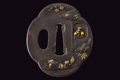 Bella tsuba, Mokko-gata in ferro con niku-bori in oro e argento