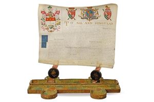 A splendid cased grant of arms document bestowing the family coat of arms
