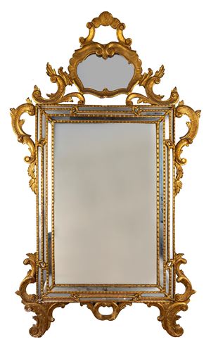 Specchiera in legno intagliato e dorato, in stile