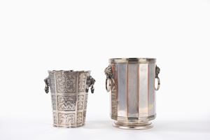 Two silver metal ice buckets with lion-shaped handles